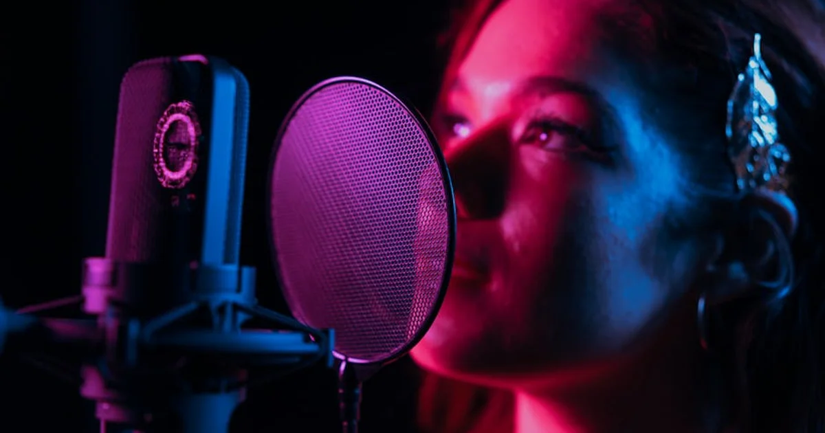 Nigerian voice actor in a professional recording studio with a microphone