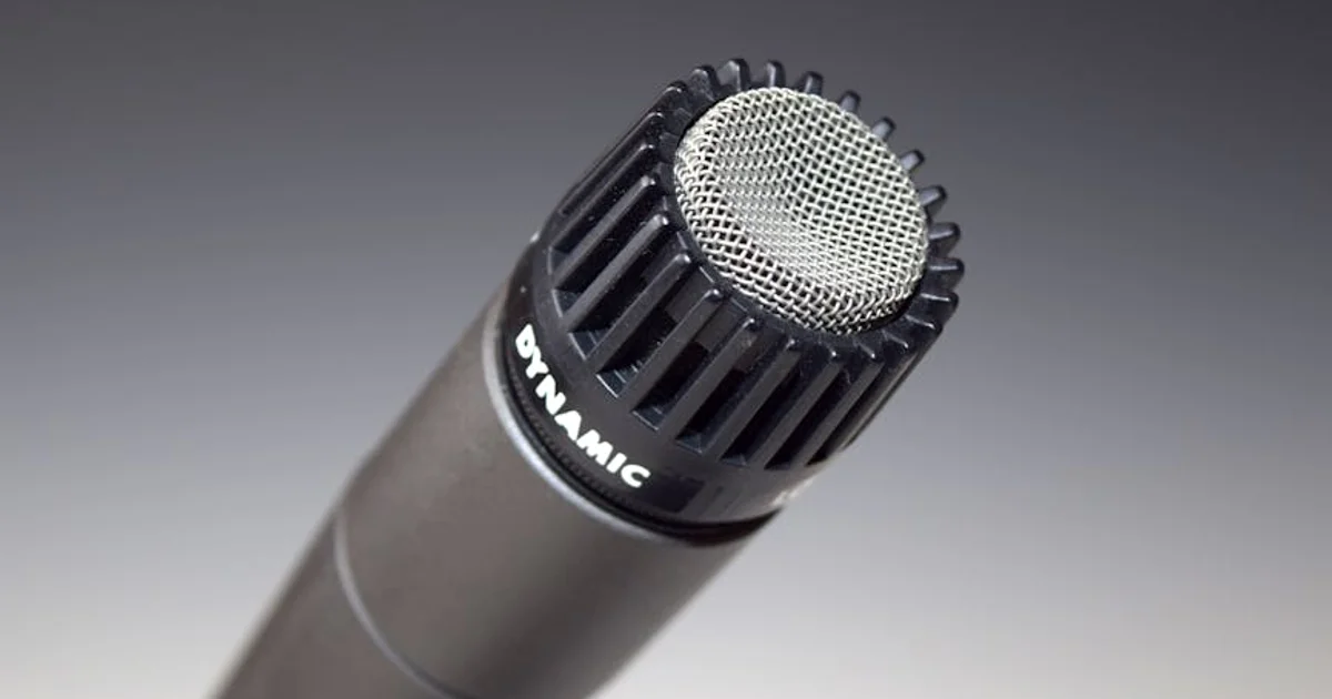 Professional Nigerian voice actor recording in a studio with a high-quality microphone