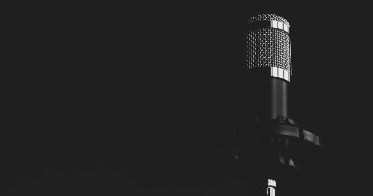 Nigerian voice actor recording in a professional studio with a high-quality microphone