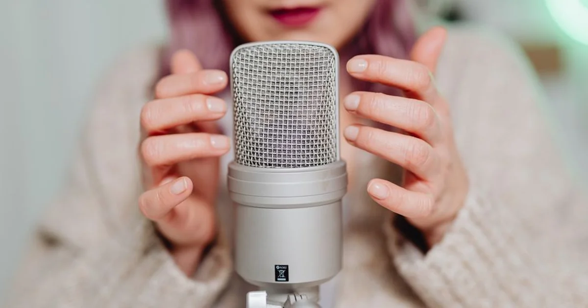 Professional Nigerian voice actor in a recording studio with a microphone