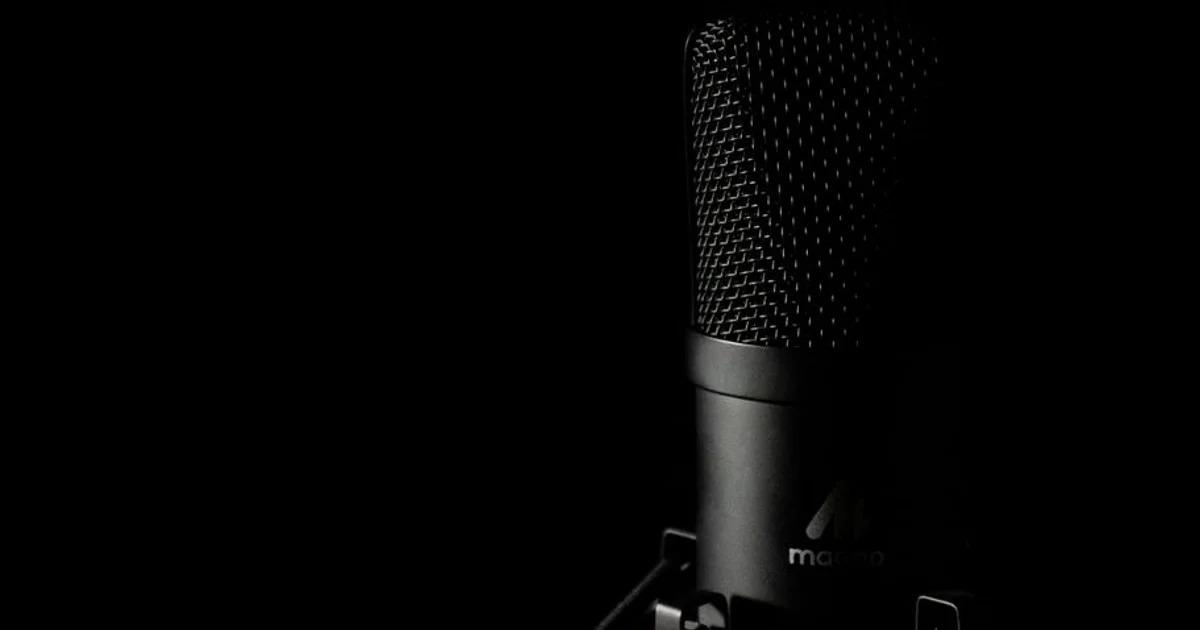 Nigerian voice actor in a recording studio with a professional microphone