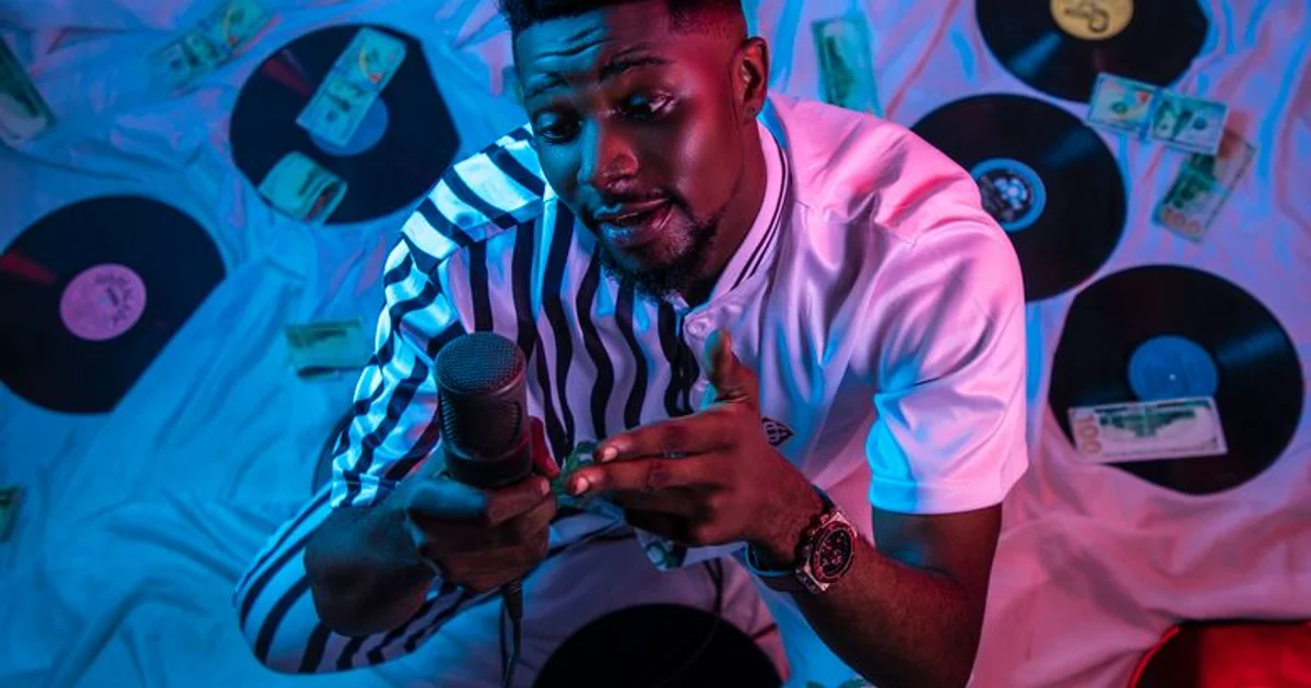 Nigerian voice actor in a recording studio with a professional microphone