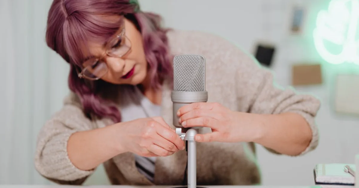 Nigerian voice actor in a professional recording studio with a microphone